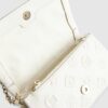Cream Embossed Monogram Cross Body Bag